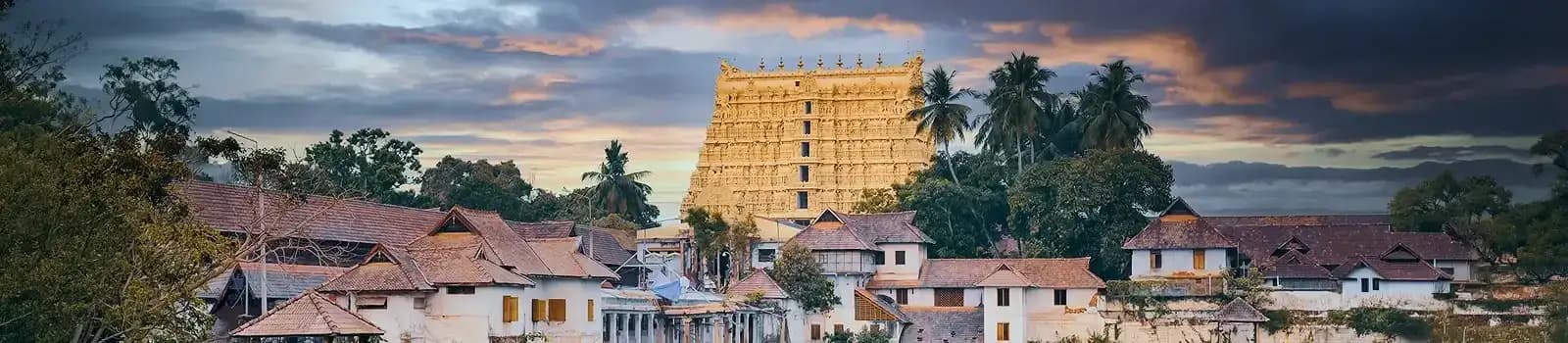 Sree Padmanabhaswamy Temple gopuram at sunset in Thiruvananthapuram, a highlight of Kerala group tours