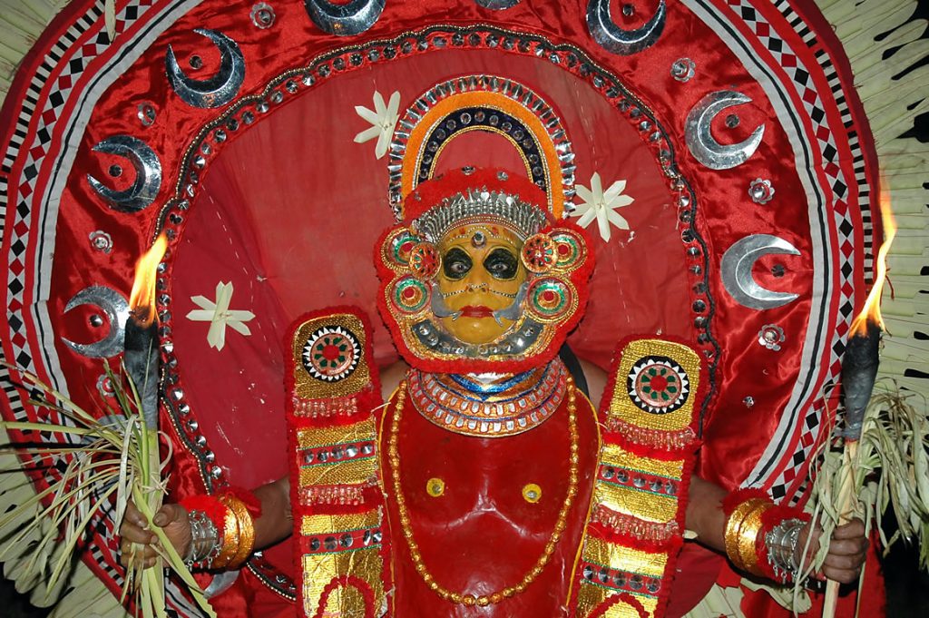 This image has an empty alt attribute; its file name is Theyyam-Festival-1024x681.jpg