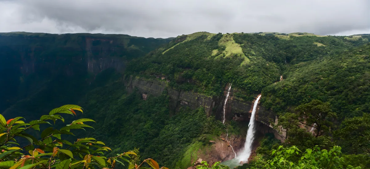 Cherrapunji in August with waterfalls and misty valley during monsoon in Meghalaya India
