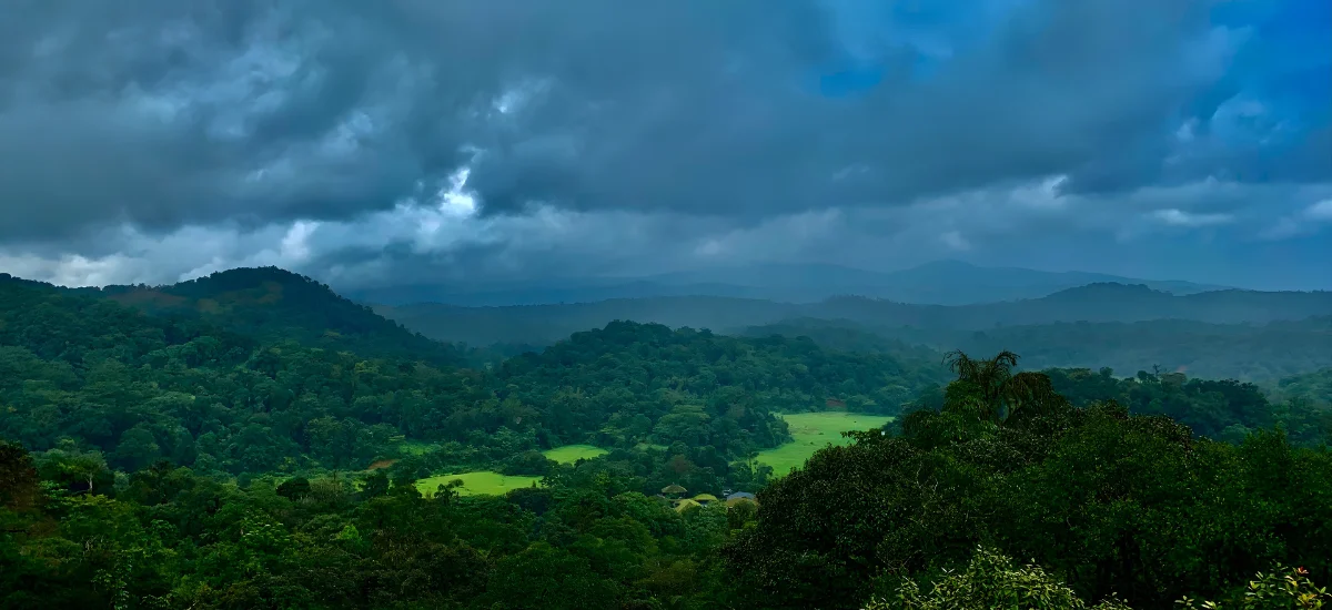 Coorg in August with lush green hills and cloudy monsoon landscape in Karnataka India