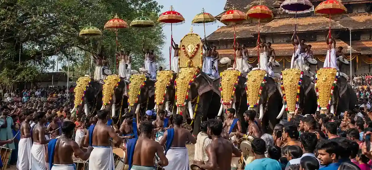 Thrissur Pooram festival in Kerala with decorated elephants, traditional drummers, and temple celebrations